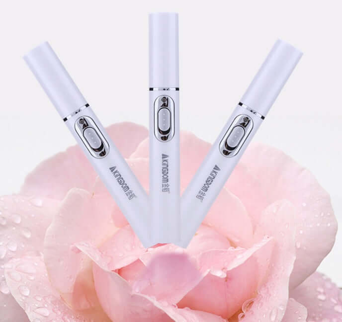 Blue light therapy acne laser pen in a floral setting, ideal for skincare and wrinkle removal treatments.
